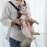 Person holding a white cat in a pink pet carrier against a white background